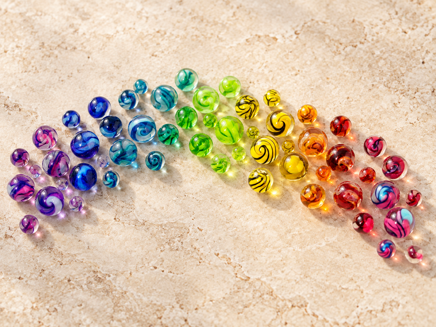 Tiny glass marbles with blue, turquoise, violet, pink, yellow and lime-green swirls