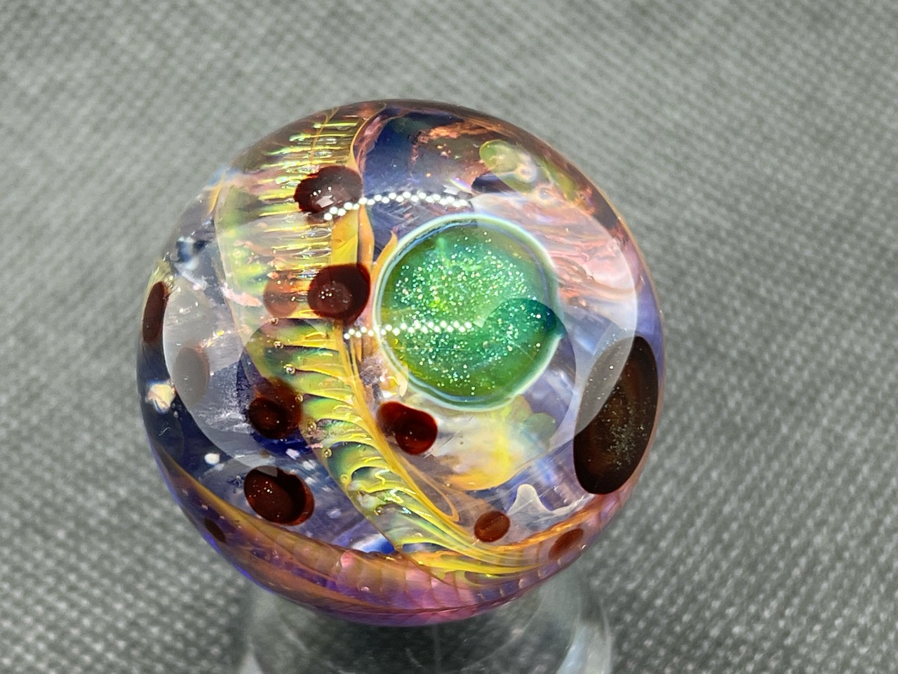 Aurora Borealis Space Marble: Sparkling green planet beside golden-green aurora ribbons and small reddish-brown worlds