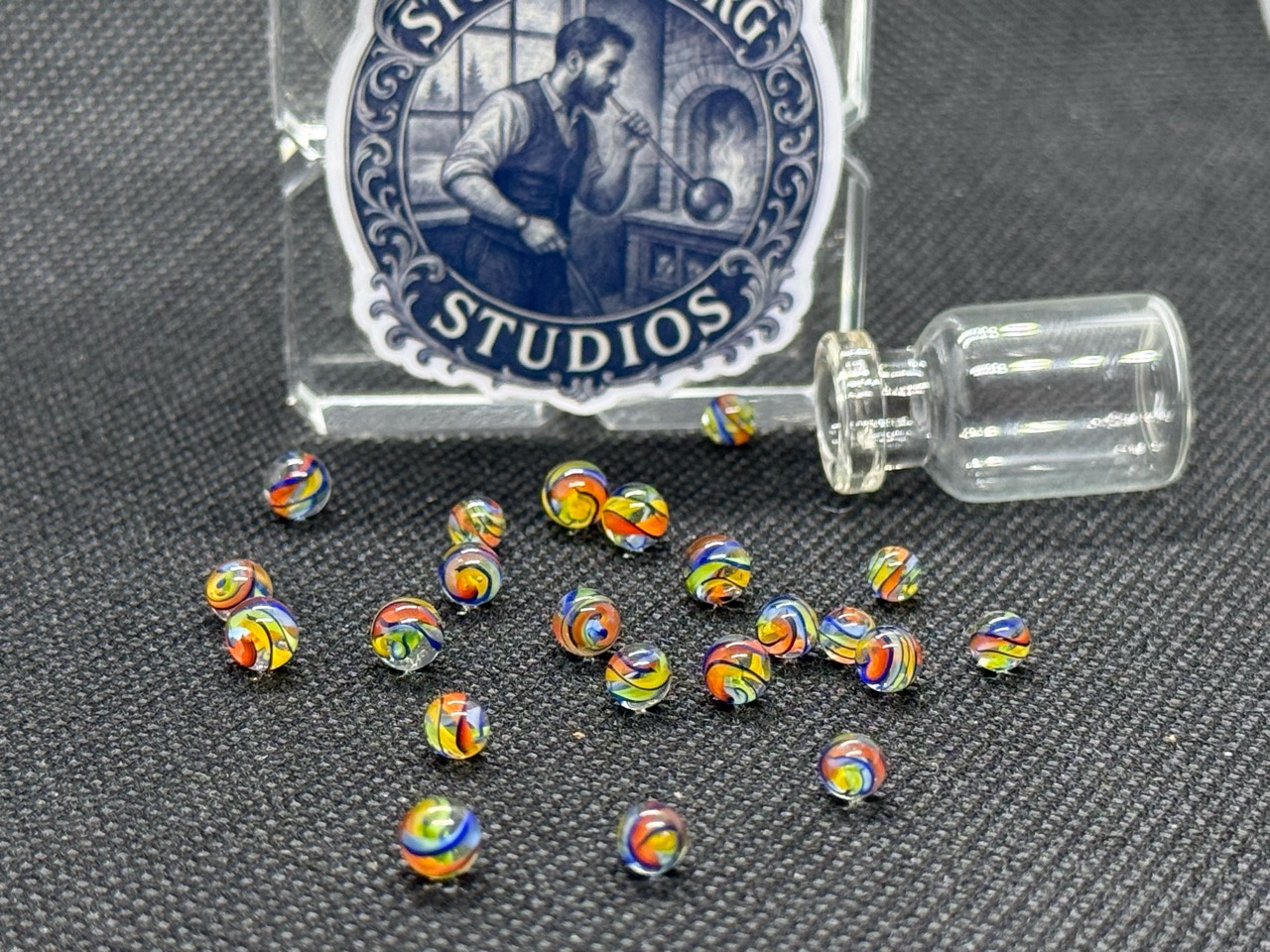 Alternate view of Electric Rainbow Mini Micro Marbles showing multicolored ribbons in ordinary light