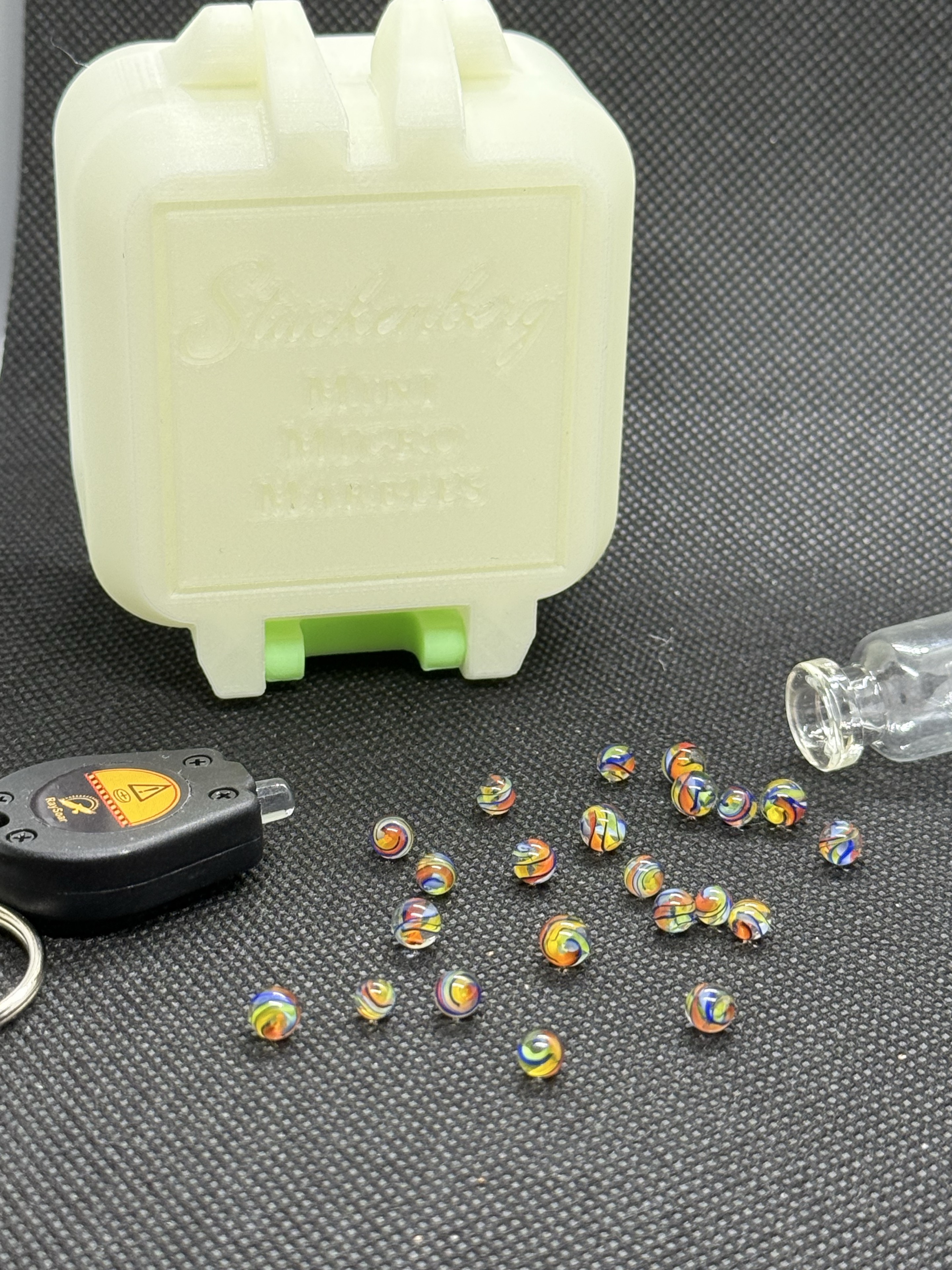 Electric Rainbow Mini Micro Marbles, included black light keychain and pale hard case in ordinary light