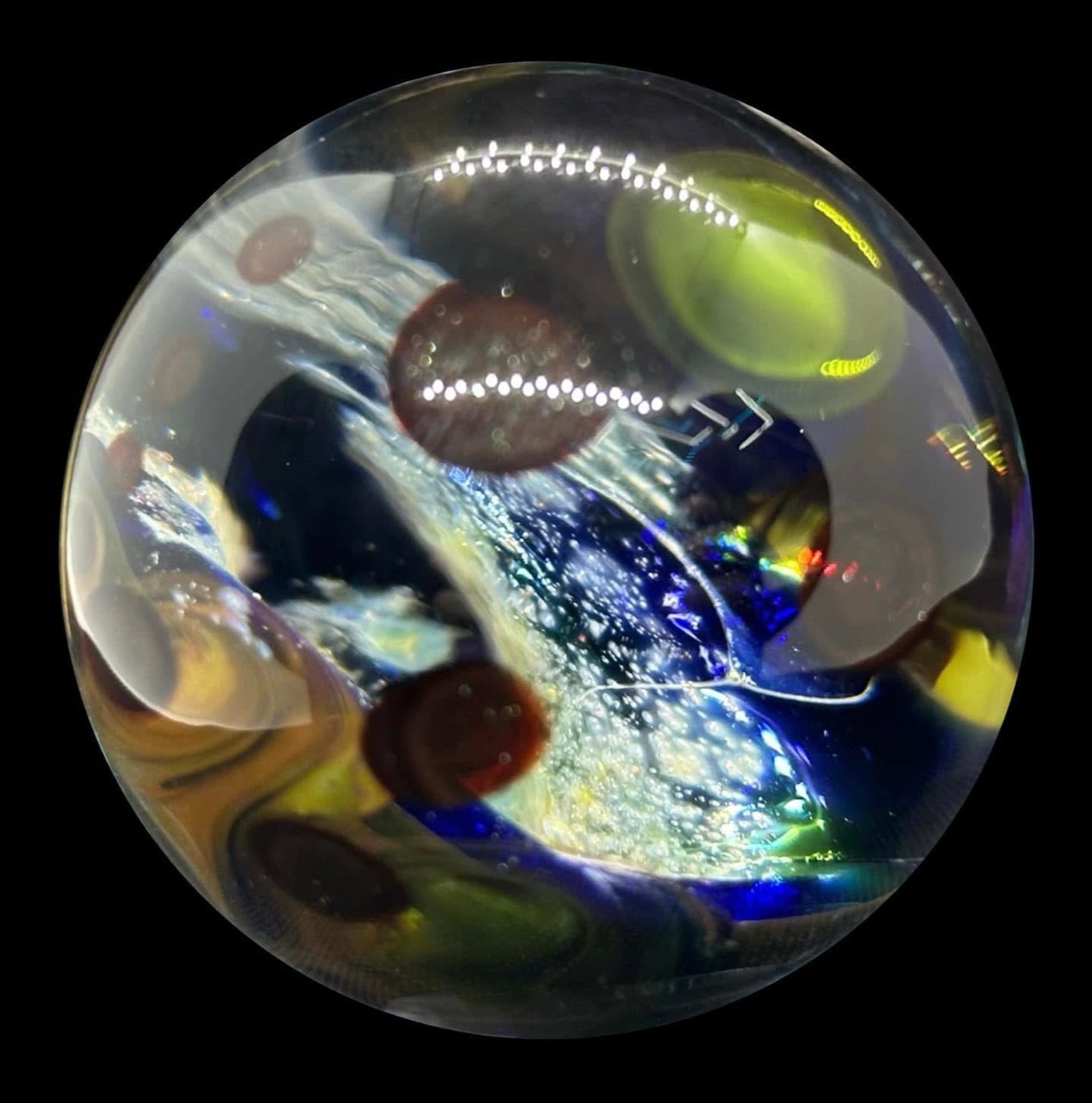 Galaxy Space Crevice Marble: bright galaxy-like stream between green and reddish planet forms