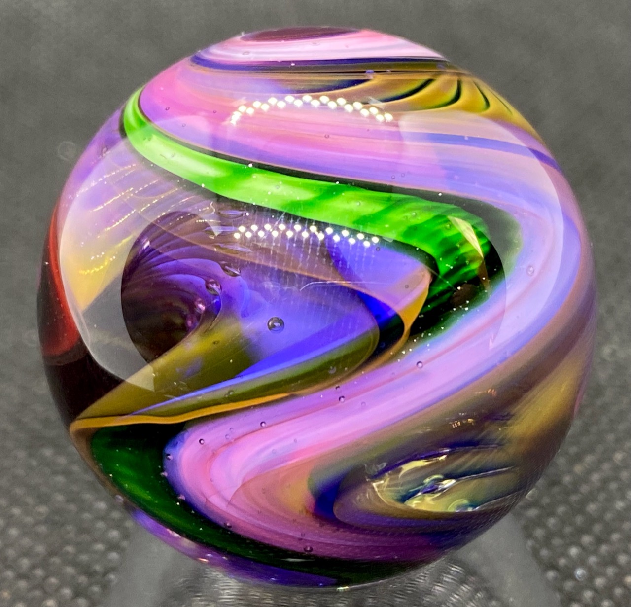 Gold and Silver Fume Washboard Marble: pink and lavender bands beside a green washboard pattern