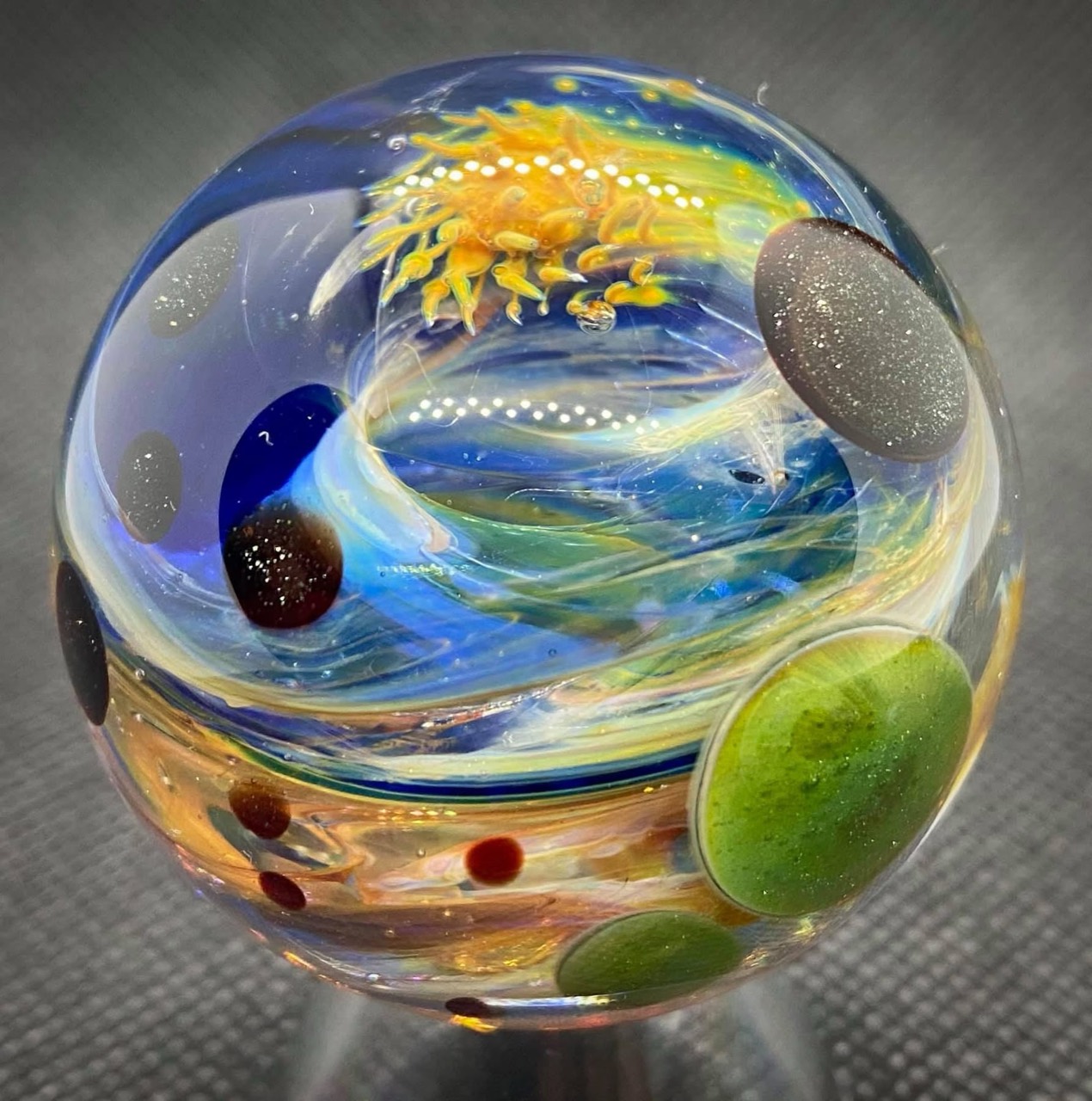 Golden Space Vortex: golden vortex above blue currents and green planetary forms