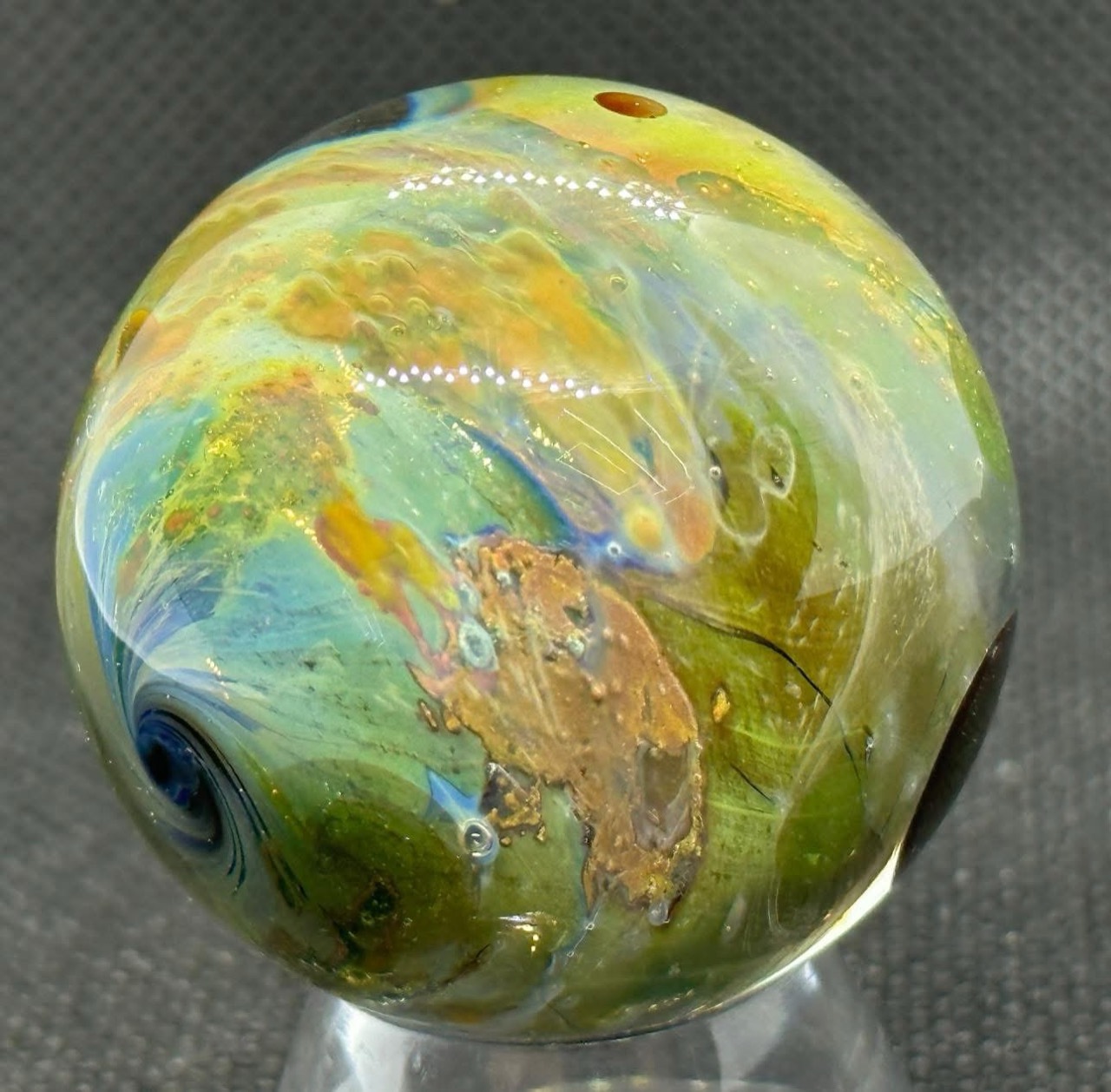 Living Planet Space Marble #4 (2023): golden terrain beside a green planet and the blue south pole
