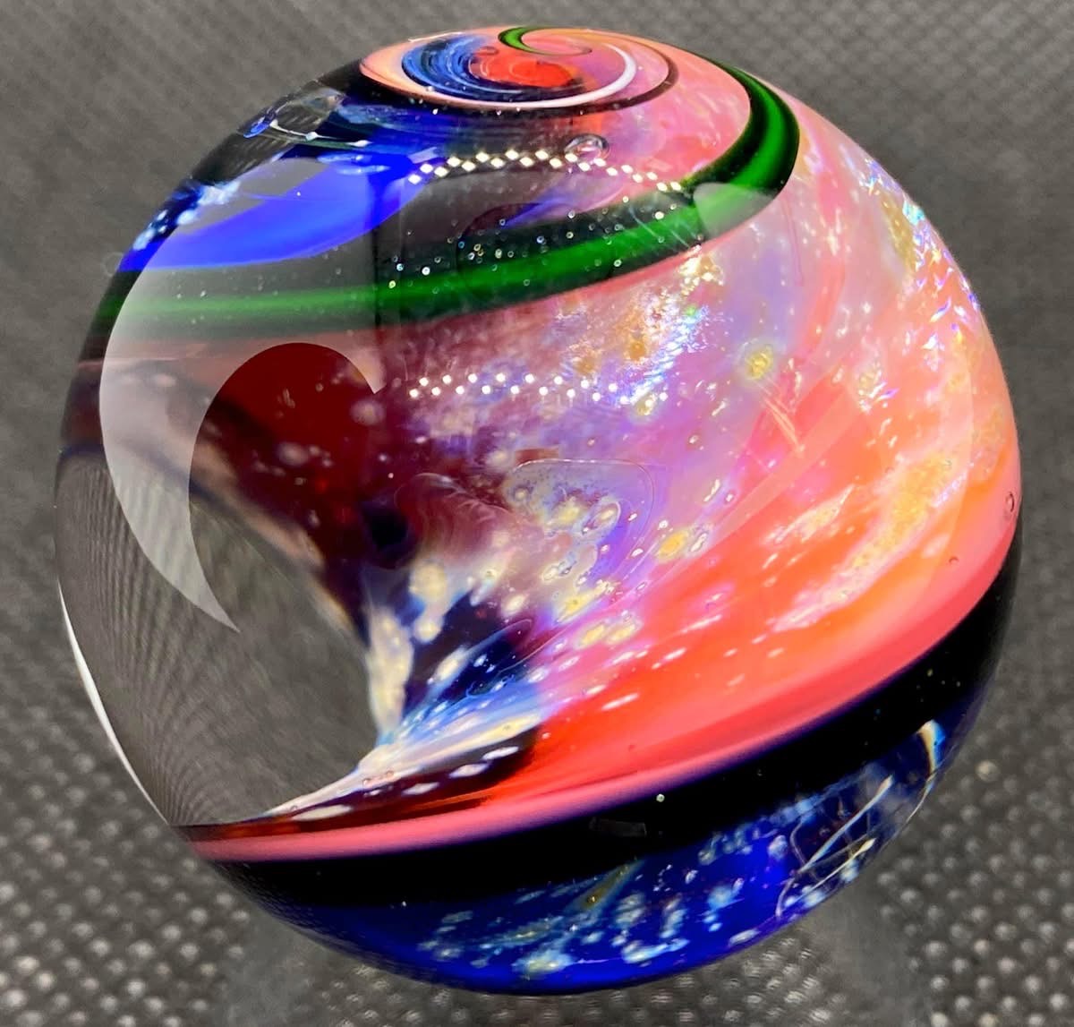 Parallel Dimension of Space Marble: pink and blue space scenes divided by sweeping dark and green ribbon bands