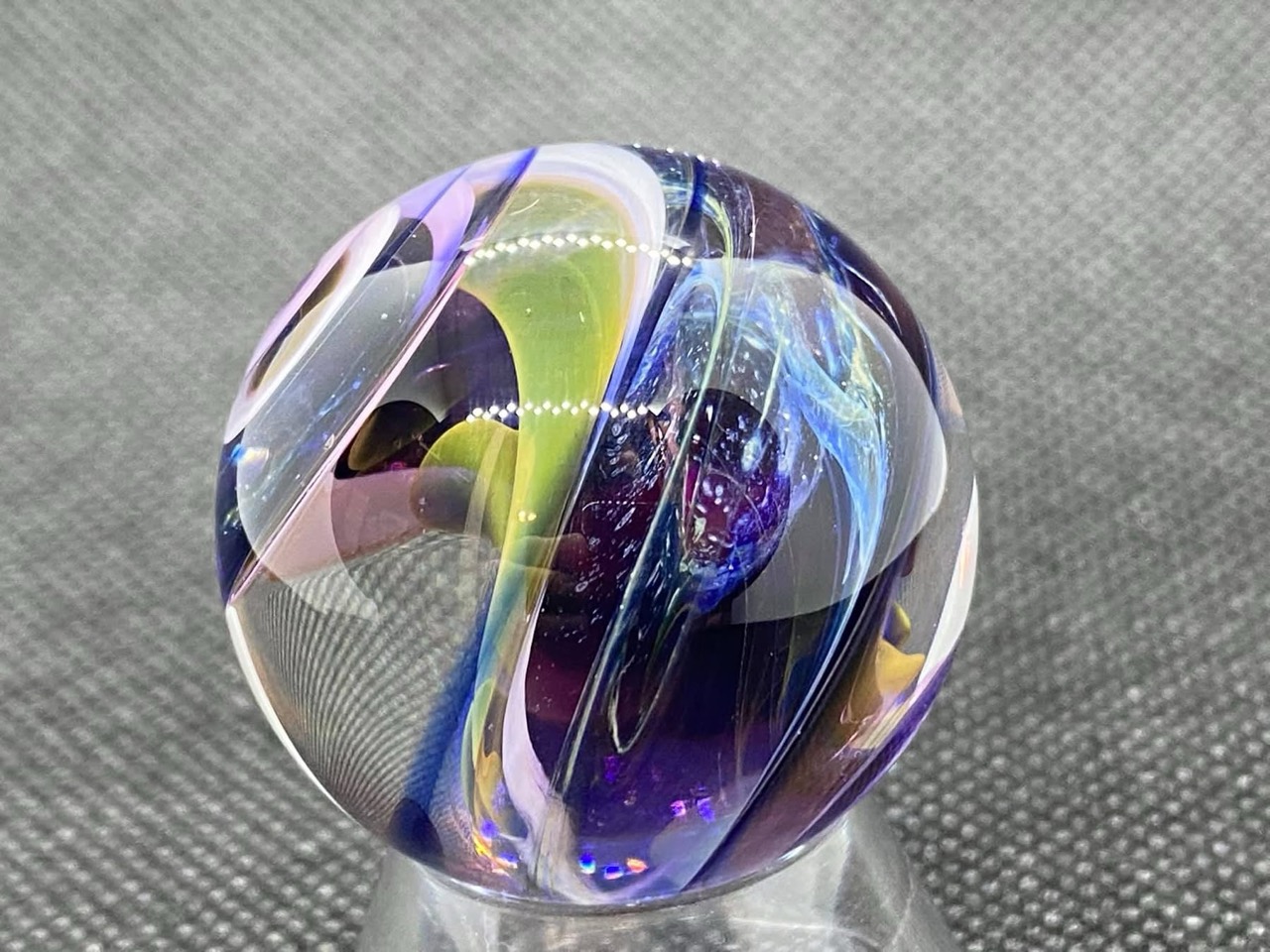 Parallel Dimensions of Space Planet Marble: blue nebula-like wisps framed by purple, pale pink and yellow-green ribbons