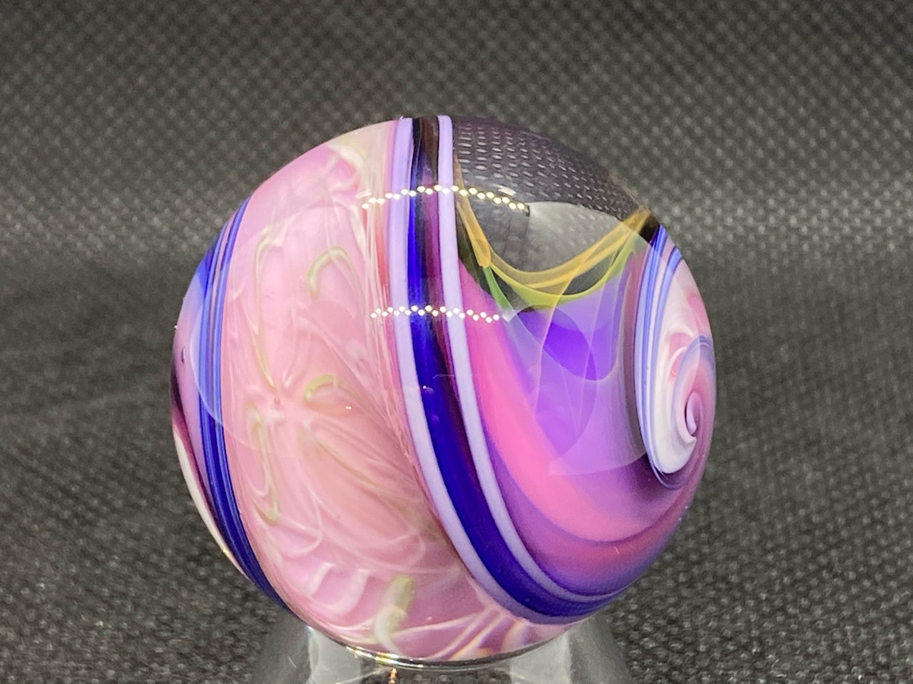 Pink & Violet Ribbon Spiral Marble: Close view of pale pink curls beside violet ribbons edged in deep blue and white