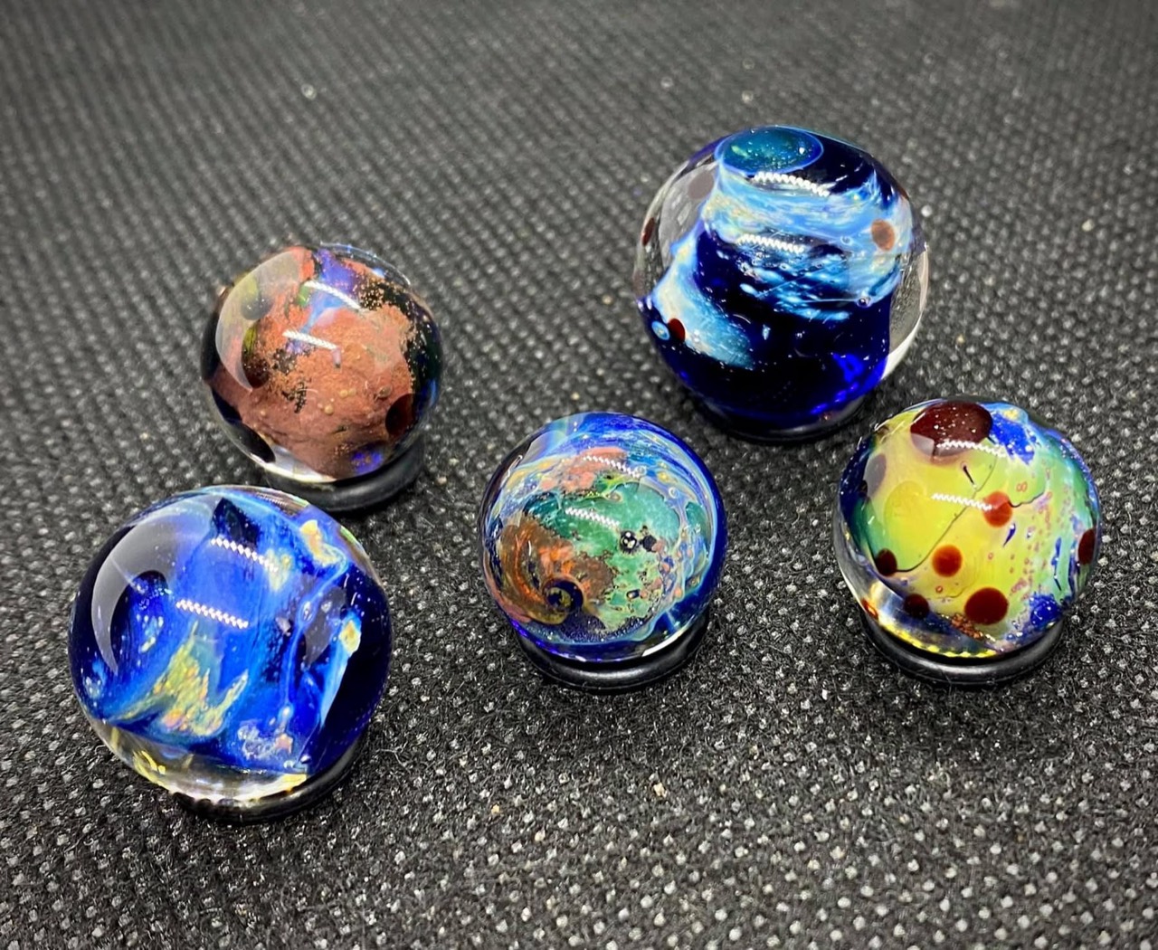 Planetary Space Pocket Marbles — Set #1: complete set of five pocket marbles with blue currents, turquoise swirls and rose-colored clouds