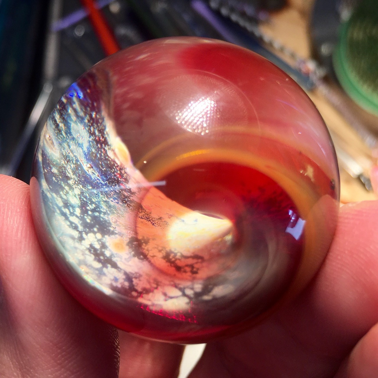 Red Planet Space Wave: Close front view of the blue-white wave curling into a ruby-red and amber vortex