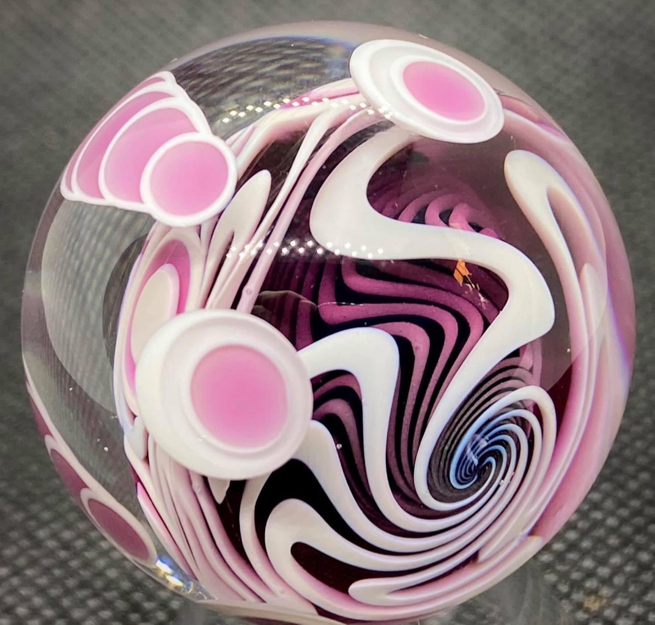 Purple Marble in Marble Dot Stack with Wigwag: angled view through pink and white dot stacks into the purple, black, and white wigwag