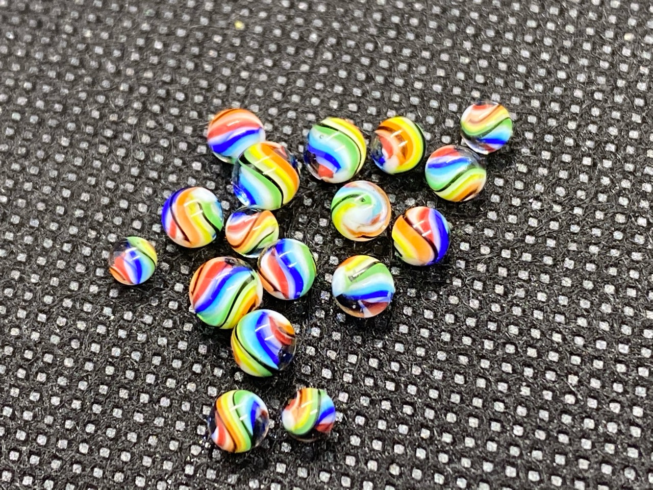 Rainbow Ribbon Mini Micro Marbles: Close group view showing the colorful ribbon patterns in the tiny marbles
