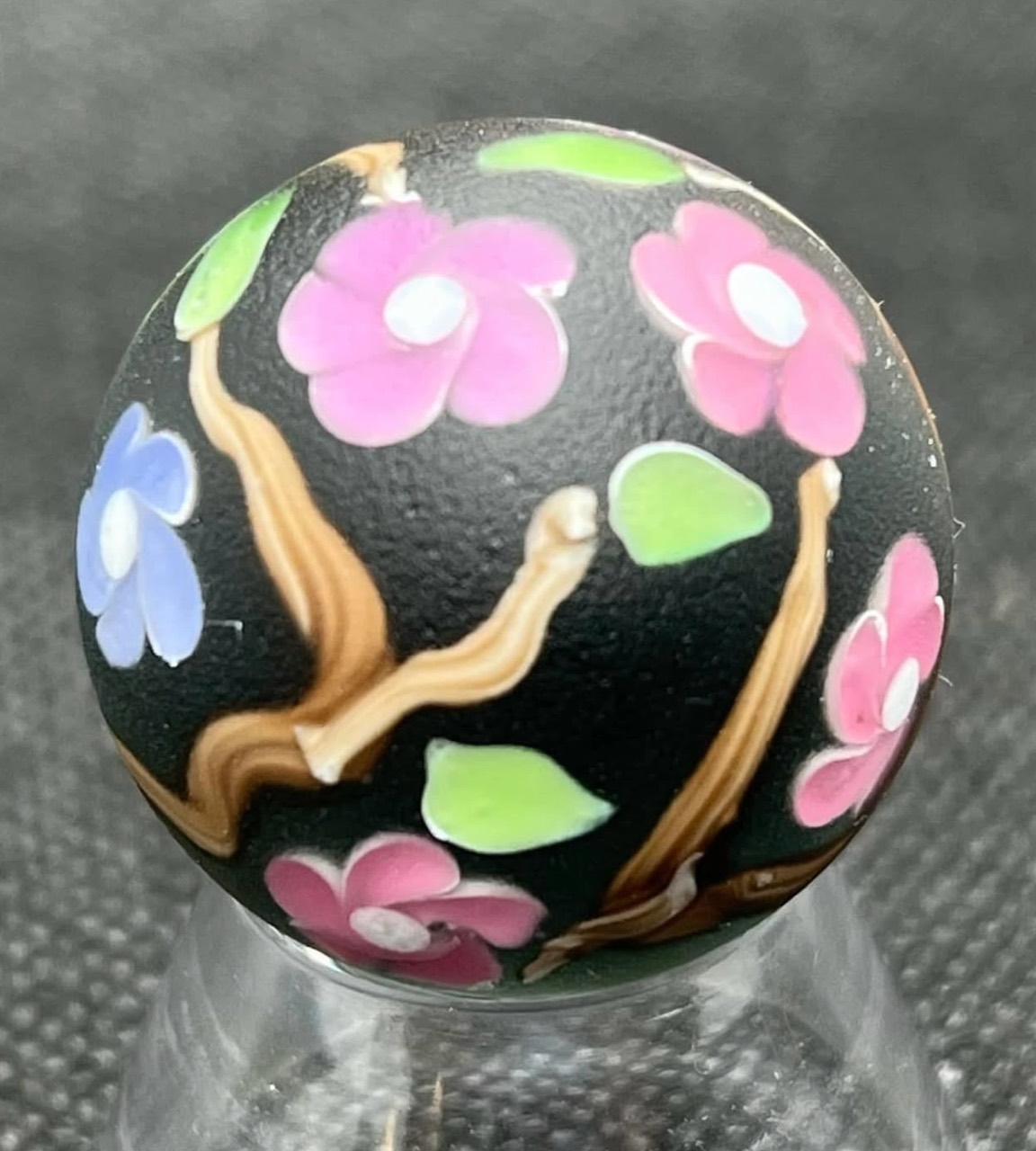 Spring Cherry Blossoms Marble — February 8, 2022: full angled view of the three-color cherry blossom tree on its clear stand