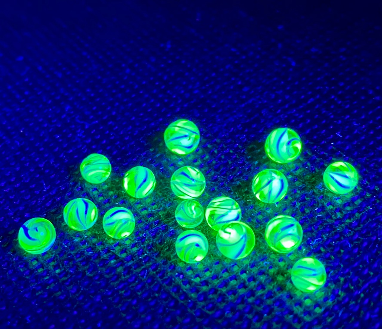UV White and Blue Uranium Mini Micro Marbles — 2021: bright green micro marbles with blue swirls under black light